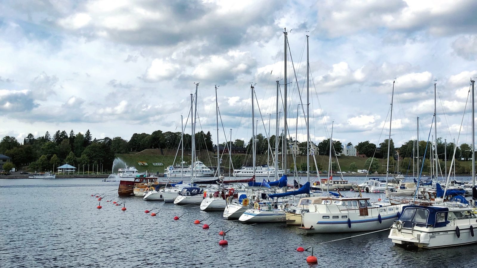 white motorboats on calm body of water