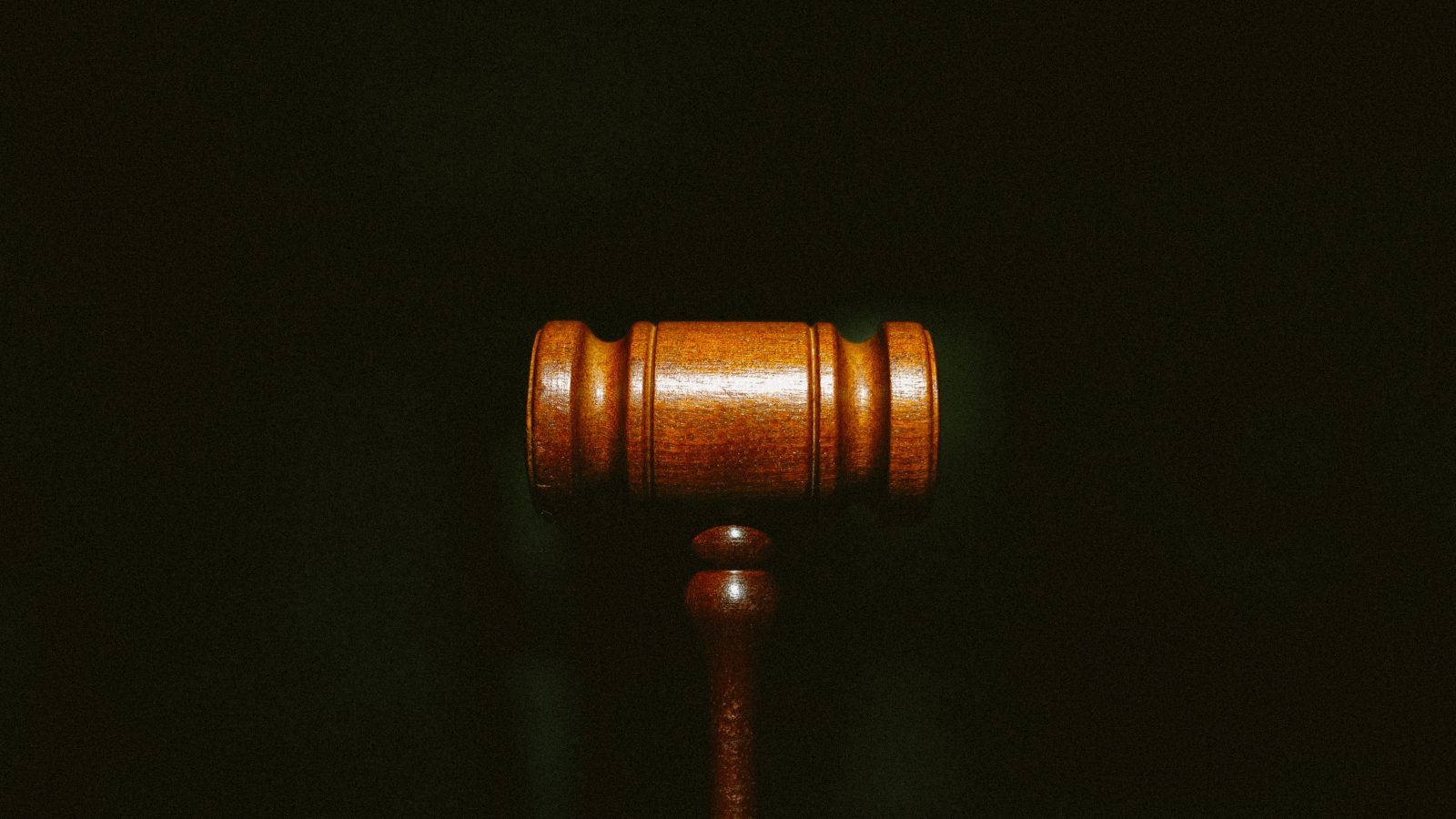 brown wooden stand with black background