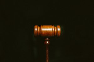 brown wooden stand with black background